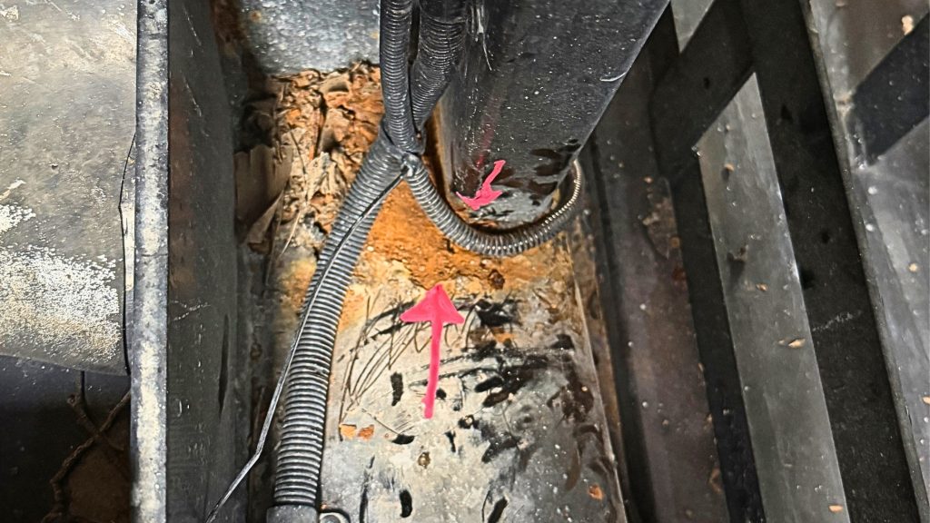 Corrosion and rust on an EWP component requiring closer inspection.
